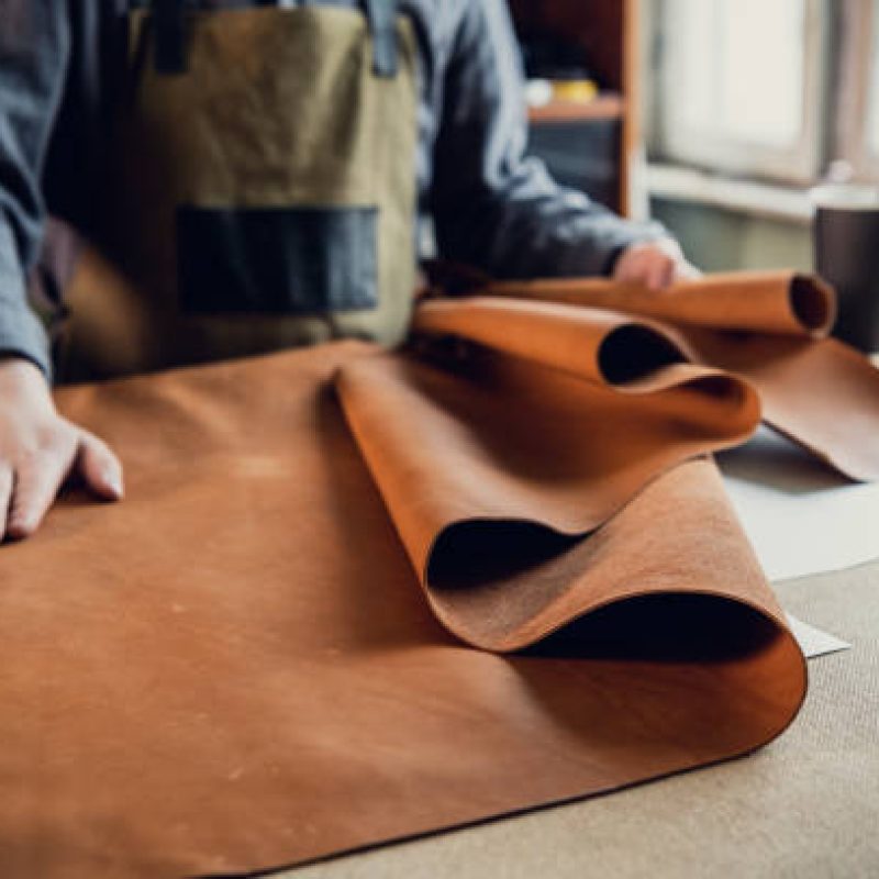 OEM luxury bag manufacturer at work in leather goods workshop